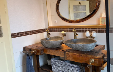 Das Badezimmer in Die Fachwerkhütte | © Die Fachwerkhütte