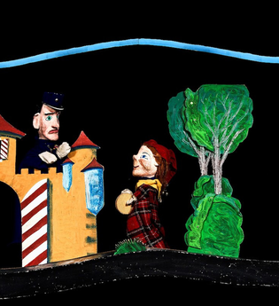Zwei Puppenfiguren in einer Theaterkulisse mit Schloss und Bäumen. | © Prinzessin Gisela Theater